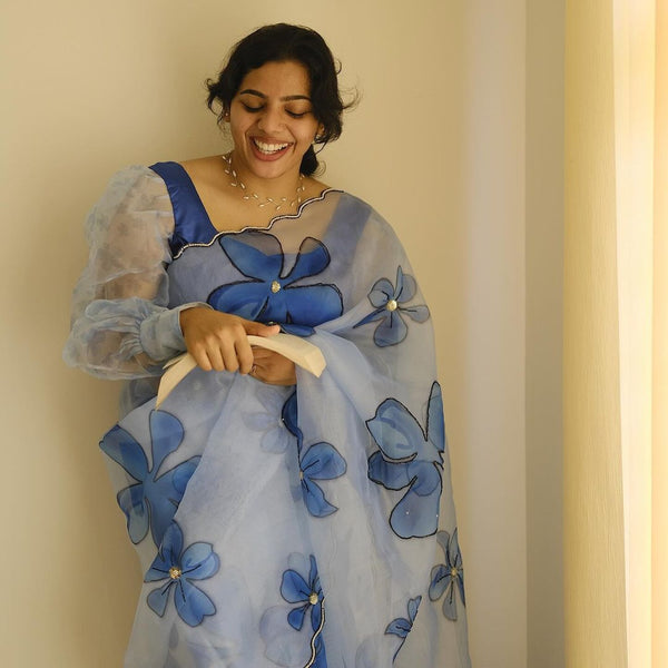 Sky Blue organza flower handprint all over saree.