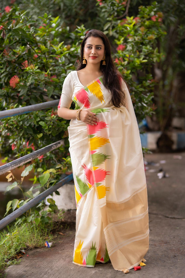 Cream soft silk multicolour temple  woven design saree.