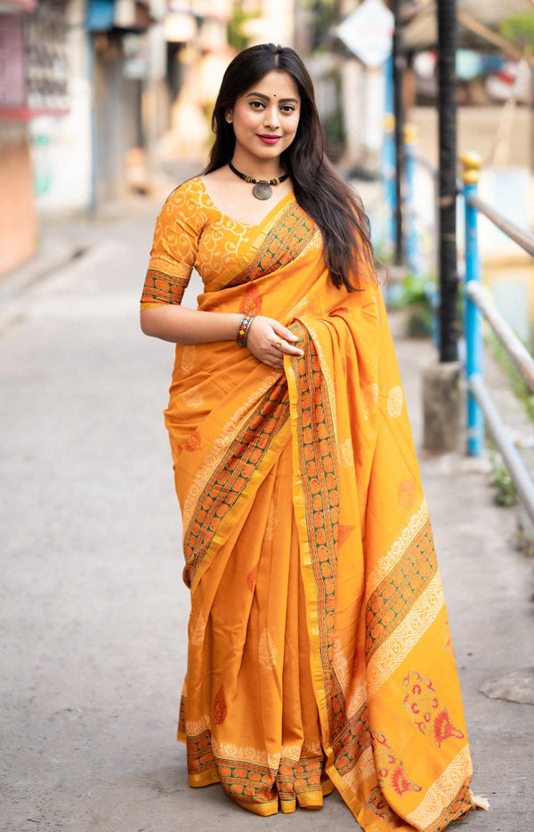 Saffron Yellow Chanderi Cotton Saree with Zari woven Pattu border.